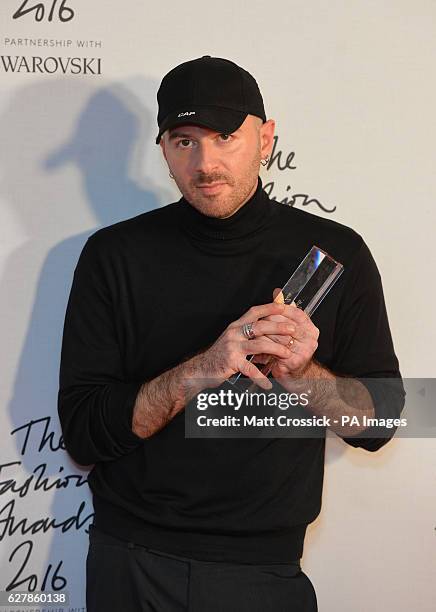 Demna Gvasalia and his award for International Ready To Wear Designer in the press room during The Fashion Awards 2016 at the Royal Albert Hall,...