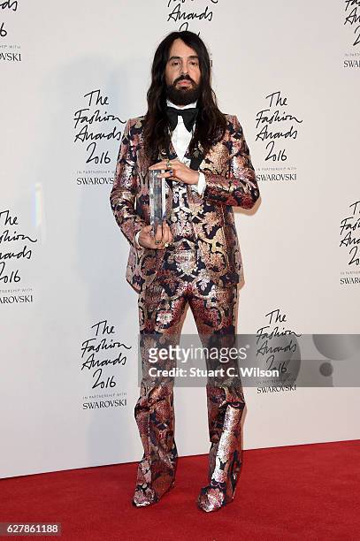 Designer Alessandro Michele poses in the winners room after winning the International Accessories Designer Award at The Fashion Awards 2016 at Royal...