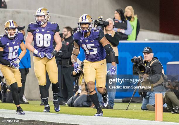 Washington Huskies tight end Darrell Daniels celebrates with teammates after a TD during the Pac-12 Championship game between the Washington Huskies...