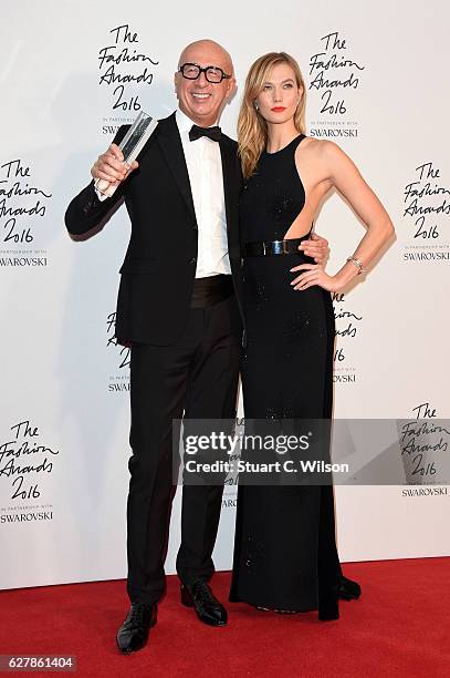 Gucci CEO Marco Bizzarri poses in the winners room with model Karlie Kloss after winning the International Business Leader Award at The Fashion...