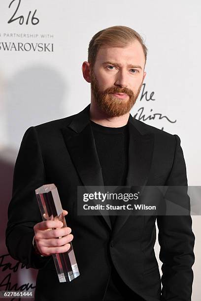 Demna CEO Guram Gvasalia poses in the winners room after winning the International RTW Designer Award at The Fashion Awards 2016 at Royal Albert Hall...