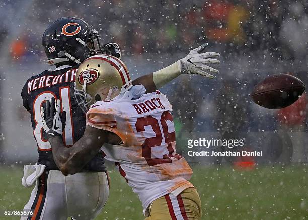 Cameron Meredith of the Chicago Bears is hit by Tramaine Brock of the San Francisco 49ers as he tries to catch a pass at Soldier Field on December 4,...