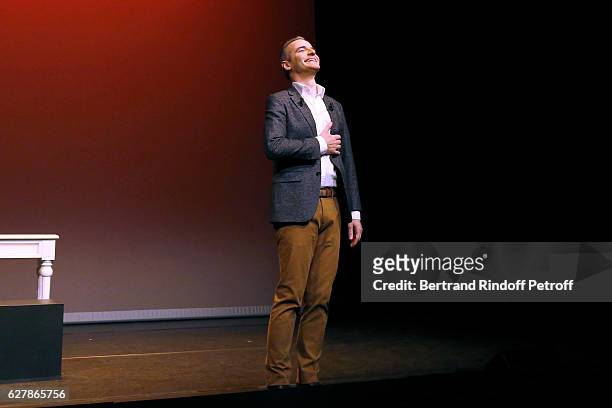 Franck Ferrand acknowledges the applause of the audience at the end of his Show "Histoires" at Theatre Antoine on December 5, 2016 in Paris, France.