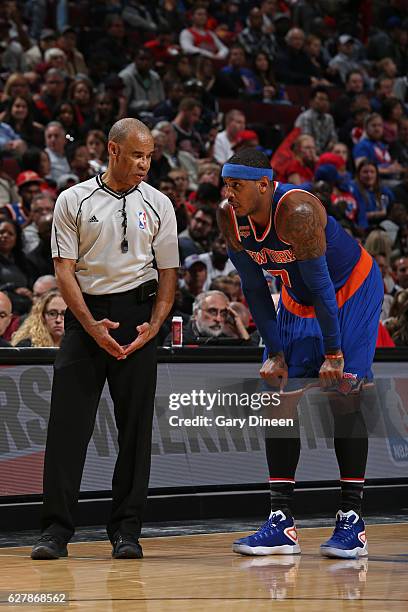 Carmelo Anthony of the New York Knicks talks with referee Dan Crawford during the game against the Chicago Bulls on November 4, 2016 at the United...