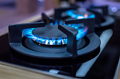 Stove. Cook stove. Modern kitchen stove with blue flames burning