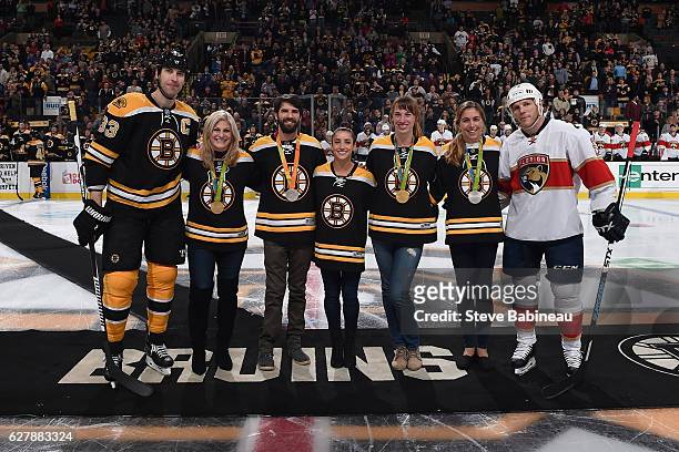 Zdeno Chara of the Boston Bruins and Shawn Thornton of the Florida Panthers pose with 2016 Rio Olympians Hugh Freund, Tessa Gobbo, Kayla Harrison,...