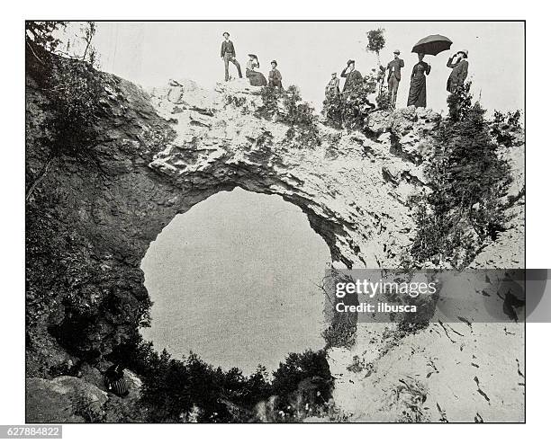 ilustrações de stock, clip art, desenhos animados e ícones de antique photograph of arch rock, mackinac island - mackinac bridge