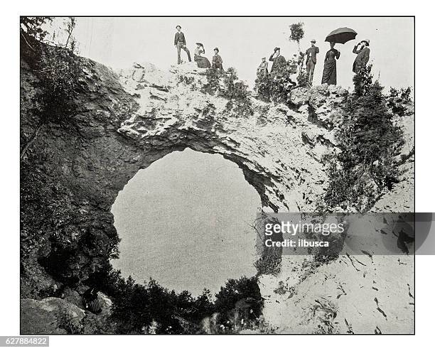antique photograph of arch rock, mackinac island - mackinac bridge stock illustrations