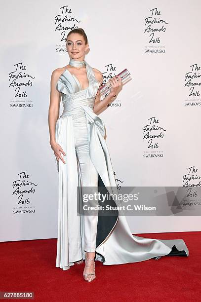 Model Gigi Hadid poses in the winners room after winning the International Model of the Year Award at The Fashion Awards 2016 at Royal Albert Hall on...