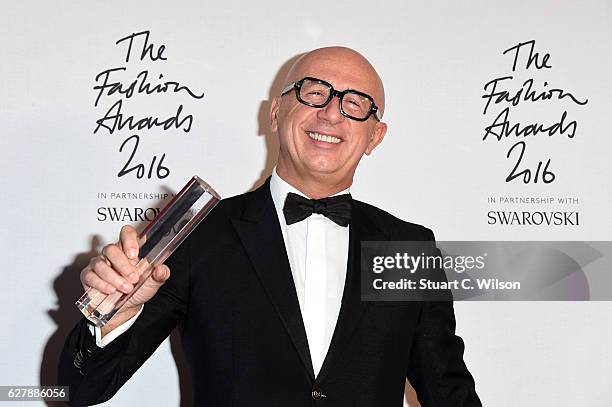 Gucci CEO Marco Bizzarri poses in the winners room after winning the International Business Leader Award at The Fashion Awards 2016 at Royal Albert...