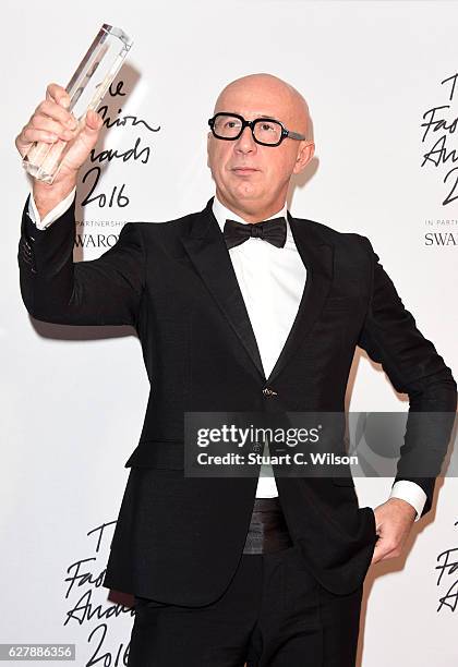 Gucci CEO Marco Bizzarri poses in the winners room after winning the International Business Leader Award at The Fashion Awards 2016 at Royal Albert...