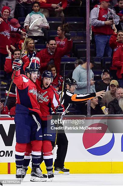 Jay Beagle of the Washington Capitals celebrates with his teammate Tom Wilson after scoring a goal against the Buffalo Sabres in the second period...