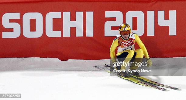 Russia - Japan Olympic captain Noriaki Kasai prepares to leave the finish area after joining the Winter Olympics men's normal hill individual...