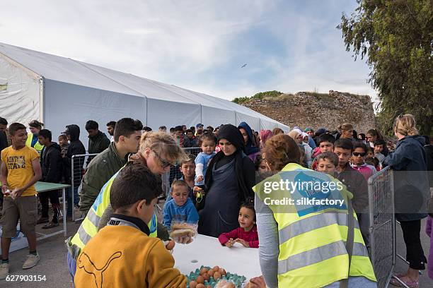 breakfast line in souda refugee camp on chios - turkish border stock pictures, royalty-free photos & images