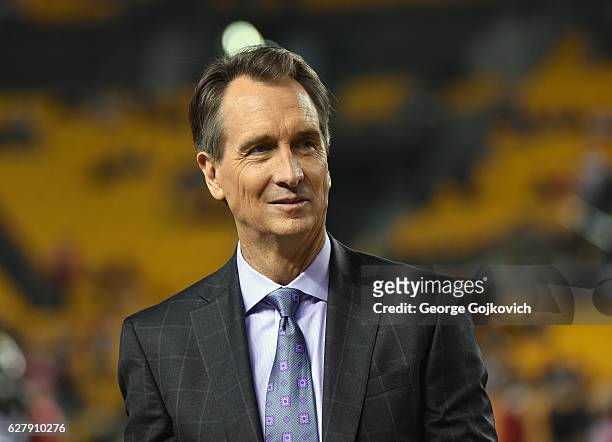 Cris Collinsworth, NBC Sports Sunday Night Football announcer, looks on from the sideline before a game between the Kansas City Chiefs and Pittsburgh...