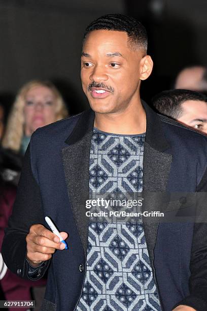 Will Smith is seen signing for fans at Kimmel on December 05, 2016 in Los Angeles, California.