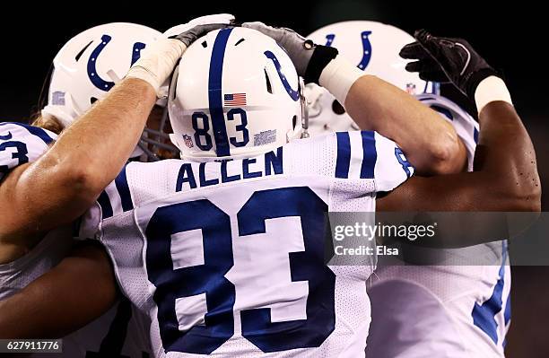 Dwayne Allen of the Indianapolis Colts celebrates his touchdown with teammates in the second quarter against the New York Jets during their game at...