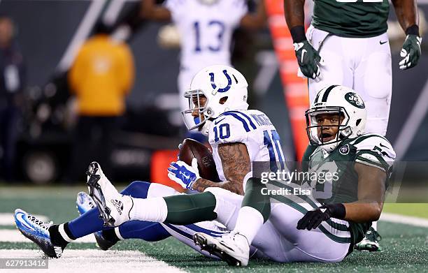 Donte Moncrief of the Indianapolis Colts completes a reception for a touchdown in the third quarter as Darron Lee of the New York Jets defends during...