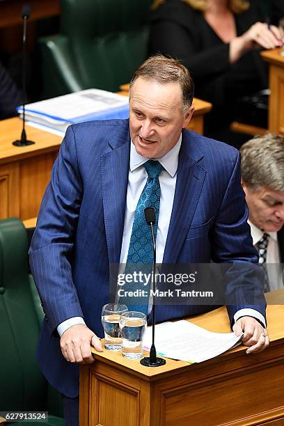 Prime Minister John Key answers questions in the house on December 6, 2016 in Wellington, New Zealand. Prime Minister John Key announced his surprise...