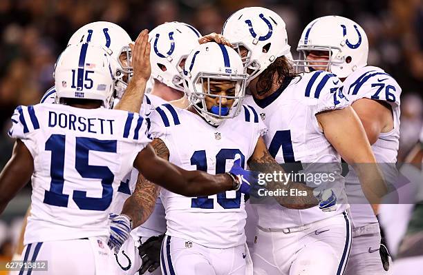 Donte Moncrief of the Indianapolis Colts celebrates his touchdown with teammates in the third quarter against the New York Jets during their game at...