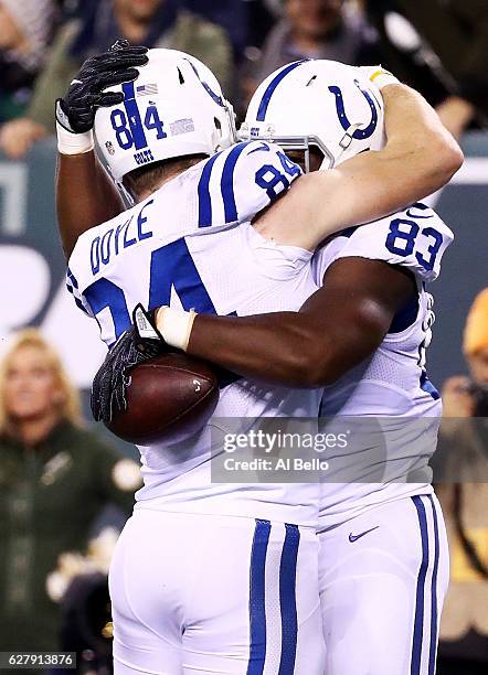 Dwayne Allen of the Indianapolis Colts celebrates his touchdown with teammates in the second quarter against the New York Jets during their game at...