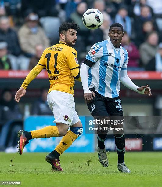 Aias Aosman of Dynamo Dresden and Romuald Lacazette of TSV 1860 Muenchen battle for the ball during the Second Bandesliga match between TSV 1860...