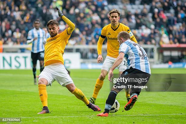 Niklas Kreuzer of Dynamo Dresden and Levent Aycicek of TSV 1860 Muenchen battle for the ball during the Second Bandesliga match between TSV 1860...