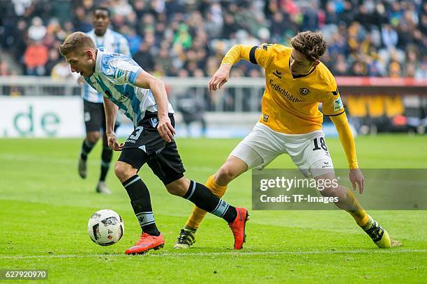 Jannik Mueller of Dynamo Dresden and Levent Aycicek of TSV 1860 Muenchen battle for the ball during the Second Bandesliga match between TSV 1860...