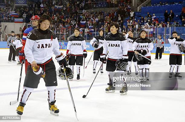 Russia - Japan's women ice hockey team looks disappointed after losing 2-1 to Russia in a Group B preliminary game in the women's ice hockey at the...