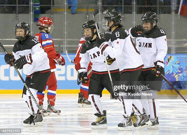 Russia - Japan defender Ayaka Toko celebrates with her teammates after scoring their first tournament goal during the third period of a Group B...