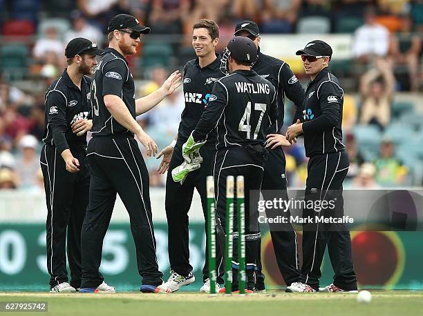 Mitchell Santner of New Zealand celebrates with team mates after taking the wicket of Aaron Finch of Australia during game two of the One Day...