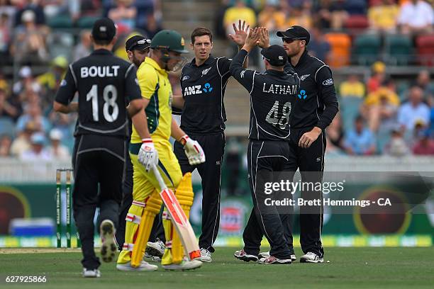 Mitchell Santner of New Zealand celebrates with team mates after taking the wicket of Aaron Finch of Australia during game two of the One Day...