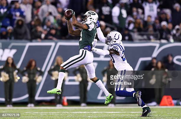 Robby Anderson of the New York Jets fails to complete a pass as Darius Butler of the Indianapolis Colts defends in the third quarter during their...