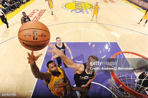 Tarik Black of the Los Angeles Lakers shoots the ball against Jeff Withey of the Utah Jazz during the game on December 5, 2016 at STAPLES Center in...