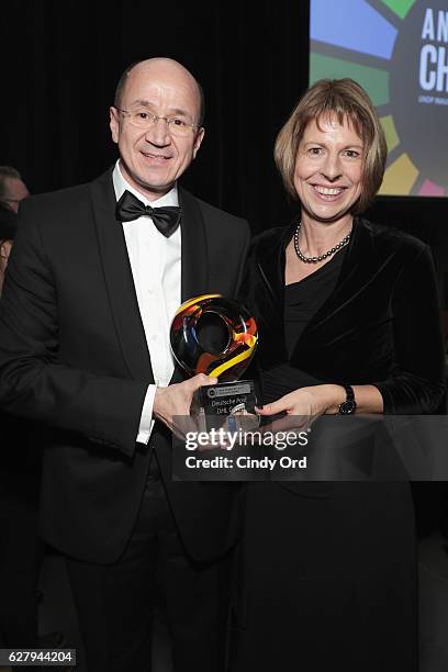 Christof Ehrhart, Head of Corporate Communications & Corporate Responsibility and EVP Deutsche Post DHL receives an award at the United Nations...