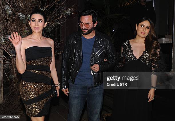 Indian Bollywood actors Karishma Kapoor , Saif Ali Khan and Kareena Kapoor Khan pose for a photograph during designer Manish Malhotra's 50th birthday...