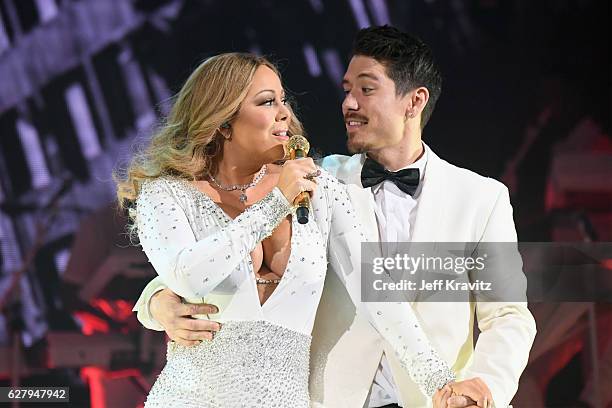 Mariah Carey and dancer Bryan Tanaka perform during the opening show of Mariah Carey: All I Want For Christmas Is You at Beacon Theatre on December...