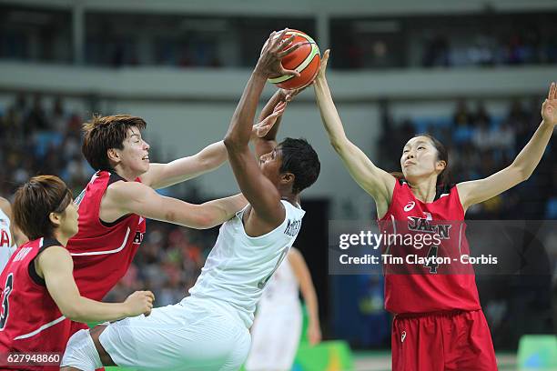 Basketball - Olympics: Day 11 Angel Mccoughtry of United States rebounds while defended by Ramu Tokashiki of Japan and Kaede Kondo of Japan during...