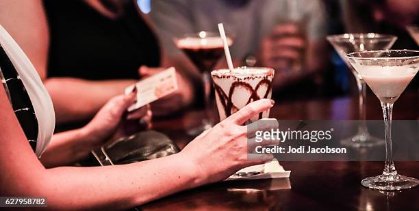 series:woman holding credit card and fattening cocktail. - frozen drink stock pictures, royalty-free photos & images