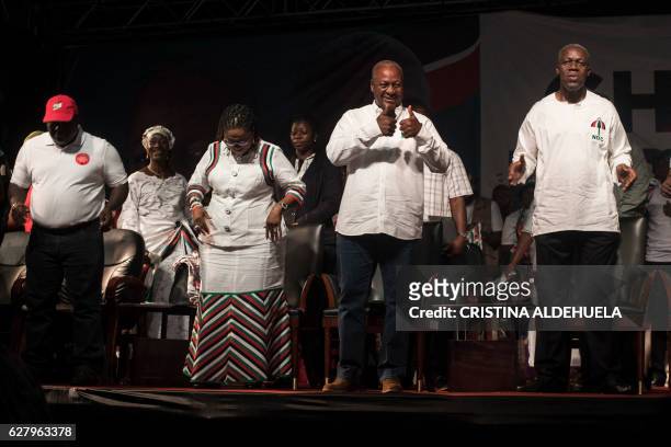 Incumbent Ghana president John Dramani Mahama , of the NDC and Kwesi Amissah-Arthur , Vice President of Ghana, gesture as they attend in the Accra...