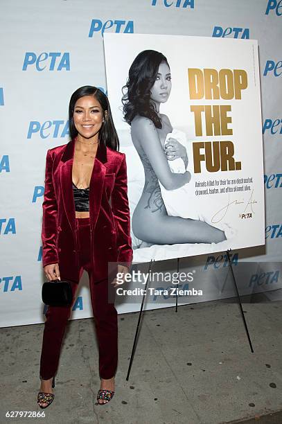 Jhene Aiko unveils her 'Rather Go Naked Than Wear Fur' ad during opening night of PETA's 'Naked Ambition' exhibit at PETA Empathy Center on December...