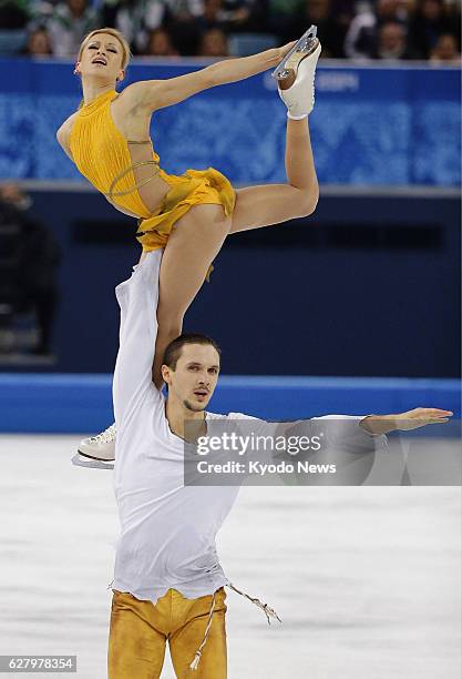 Russia - Russia's Maxim Trankov lifts his partner Tatiana Volosozhar during the pairs free program of the Winter Olympics figure skating event at the...