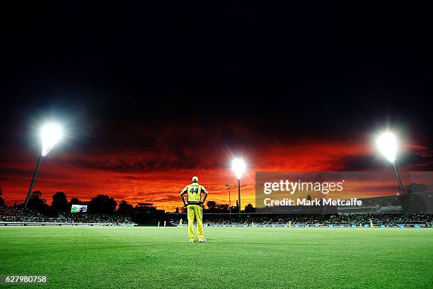 James Faulkner of Australia fields near the boundary rope as the sun sets during game two of the One Day International series between Australia and...