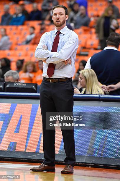 Assistant coach Gerry McNamara of the Syracuse Orange looks on prior to the game against the North Florida Ospreys at the Carrier Dome on December, 3...