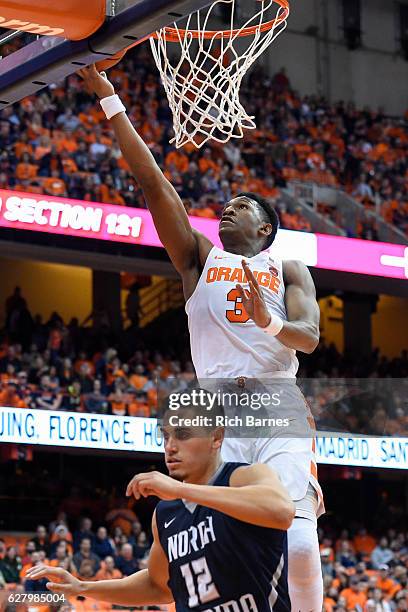 Andrew White III of the Syracuse Orange shoots the ball over Aaron Bodager of the North Florida Ospreys during the second half at the Carrier Dome on...