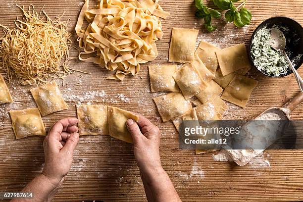 woman making pasta - making stock pictures, royalty-free photos & images
