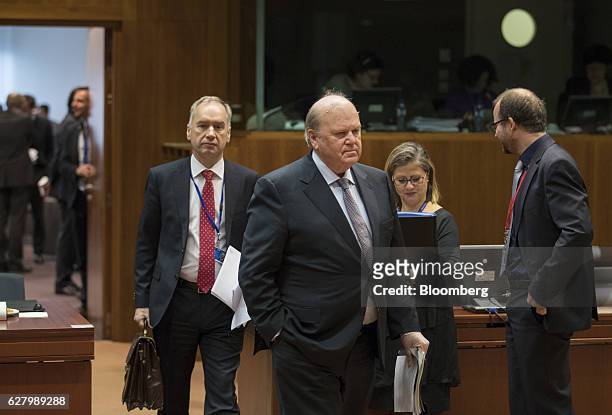 Michael Noonan, Ireland's finance minister, center, arrives ahead of an Ecofin meeting of European Union finance ministers in Brussels, Belgium, on...