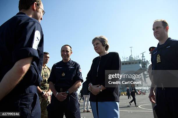 British Prime Minister Theresa May meets sailors during a visit to HMS Ocean while in Bahrain to attend the Gulf Cooperation Council summit in...