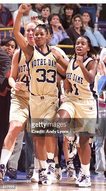 Niele Ivey and Imani Dunbar of Notre Dame celebrate at the end of the semifinals of the NCAA Women's Final Four at the Savvis Center in St. Louis,...