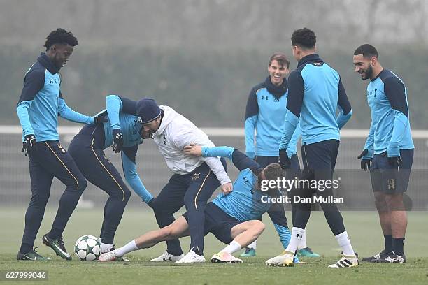 Mauricio Pochettino, Manager of Tottenham Hotspur is tackled by Kieran Trippier of Tottenham Hotspur during the Tottenham Hotspur FC training session...